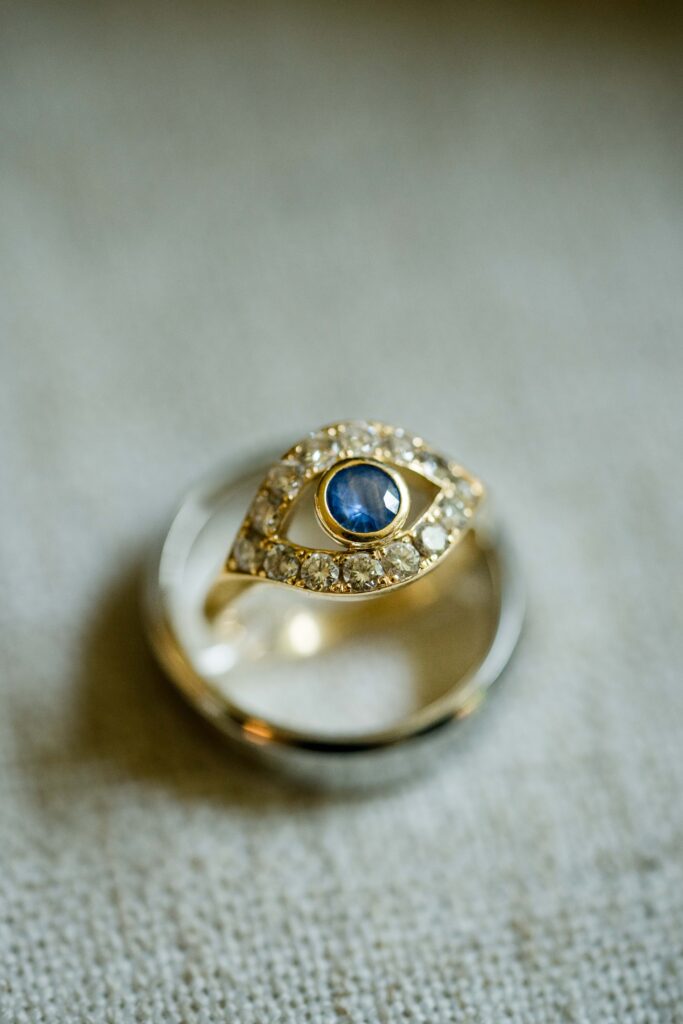Diamond surrounded sapphire custom engagement ring designed by Max