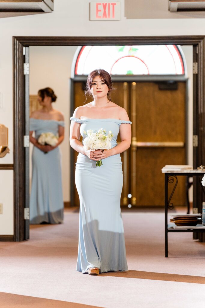 Bridesmaid down the aisle
