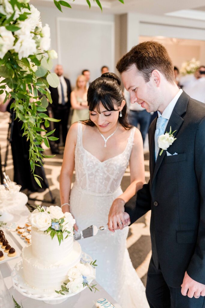 Bride and groom cutting the cake