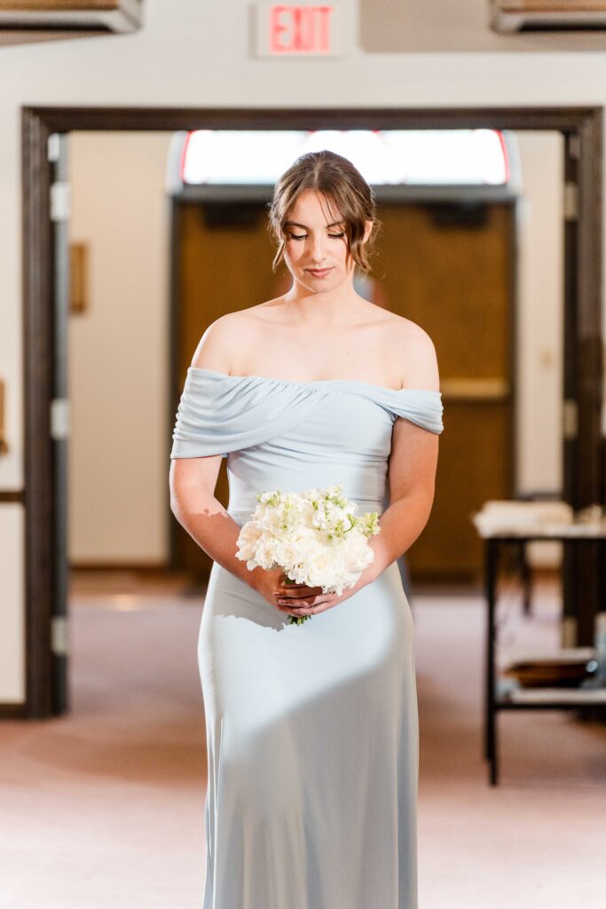 Bridesmaid walking down the aisle