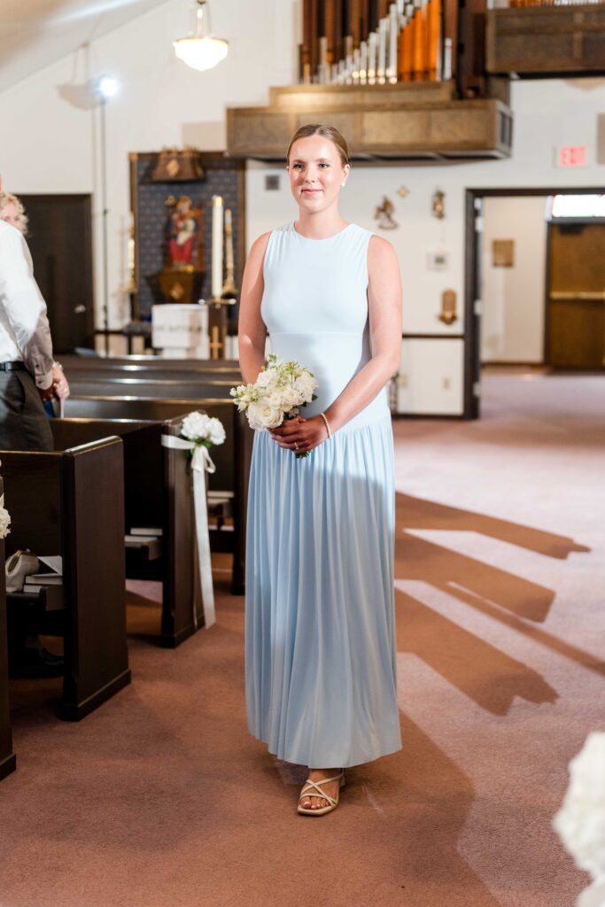 Bridesmaid walking down the aisle