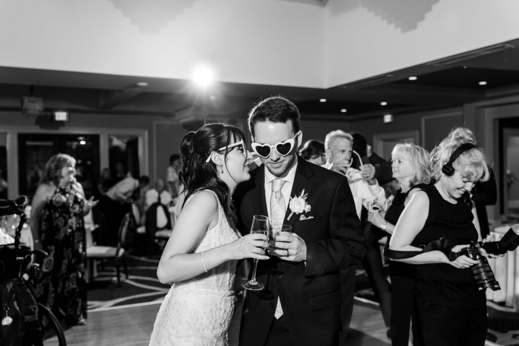 Max and Sertap dancing and having fun as they wear glasses