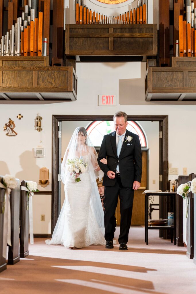 Max's dad and Sertap walking down the St. Paul's Church aisle in Grand Rapids
