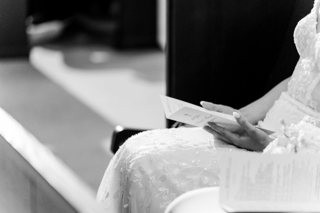 Sertap reading her program for the wedding