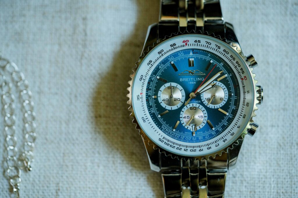 Max wearing Breitling watch while getting ready at his family home