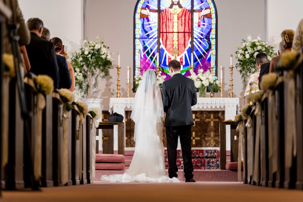 Max and Sertap pray in grand rapids church