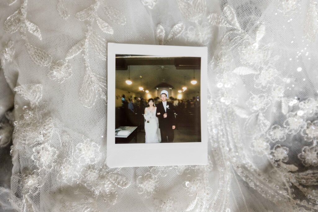 Max and Sertap walking down the aisle pictured in a Polaroid