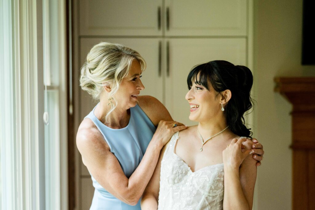 Bride and mother-in-law getting ready for a wedding at Blythefield Country Club