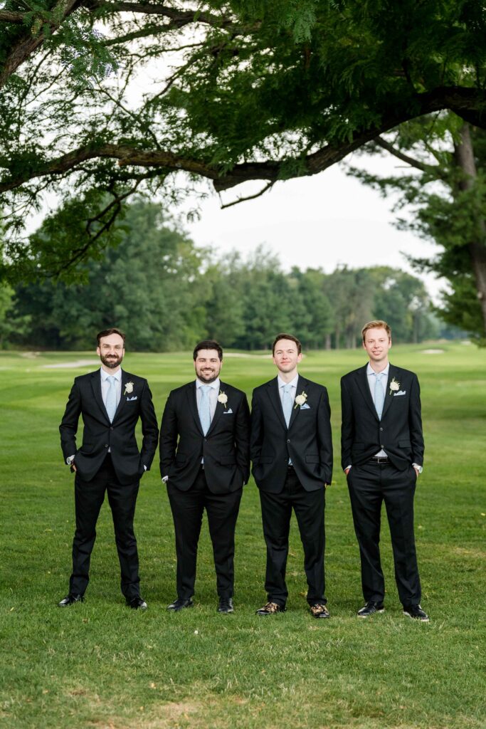 Max and his groomsmen pose for bridal party photos at Blythefield