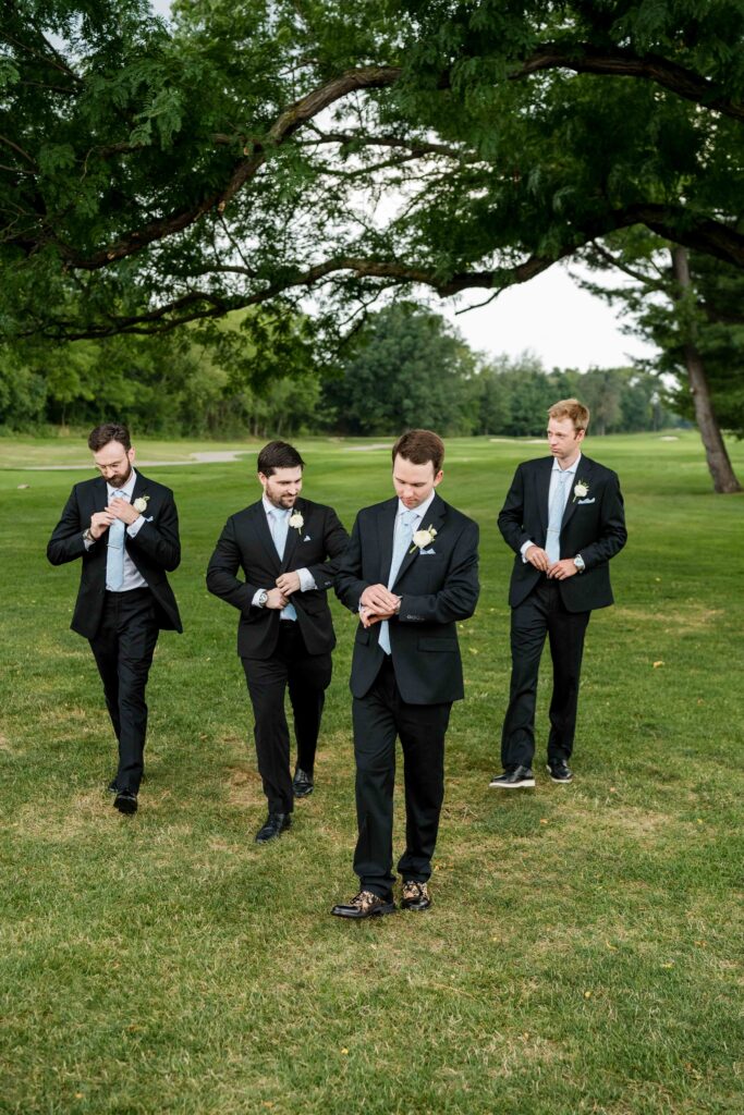 Max and his groomsmen pose for bridal party photos at Blythefield