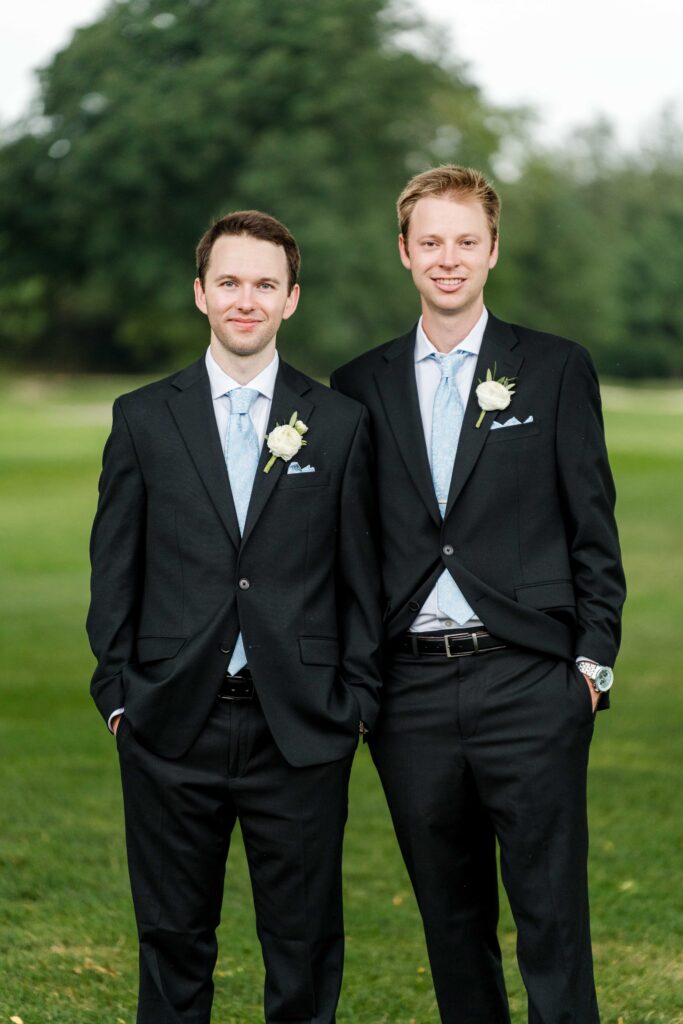 Max and his brother pose at the golf course