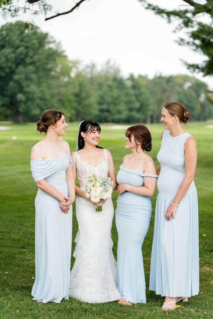 Sertap and her bridesmaids laughing together at Blythefield