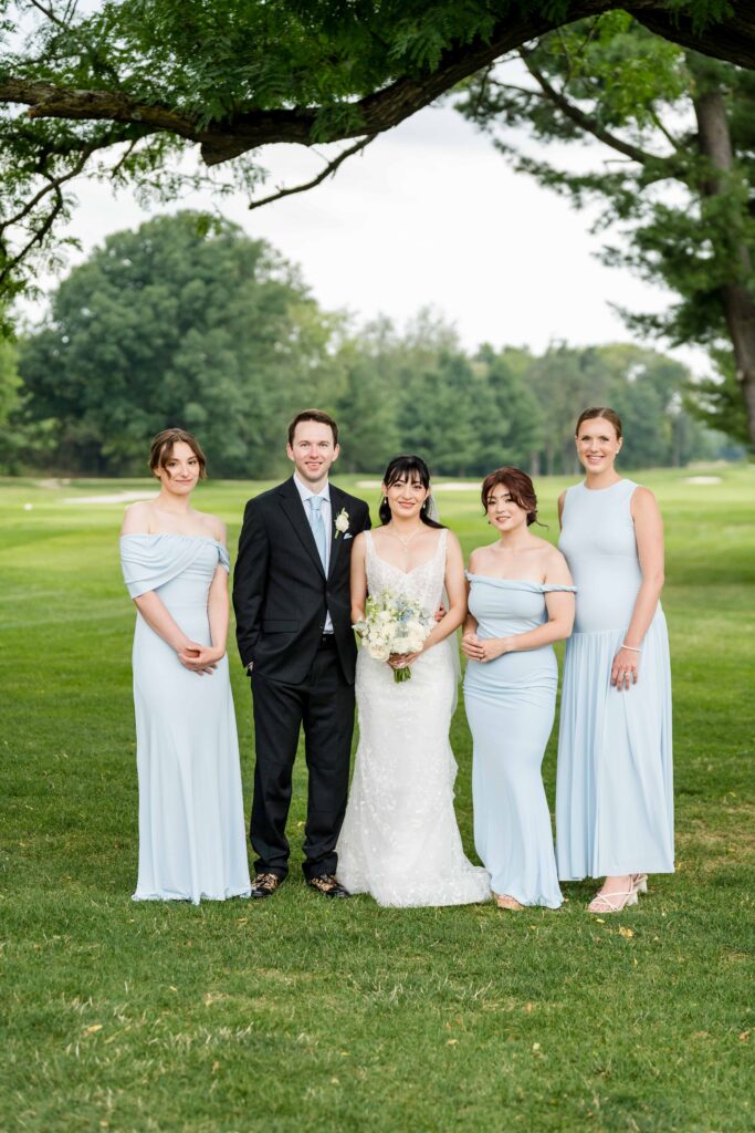 Sertap and Max posing with bridesmaids at Blythefield