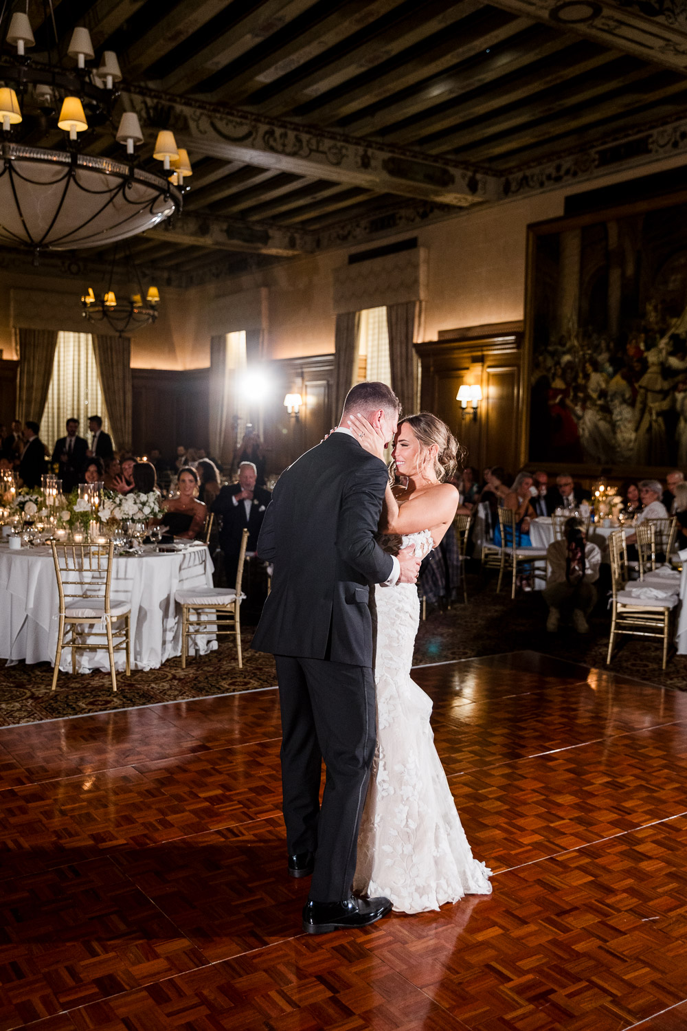 Bride and groom sharing their first dance in the elegant ballroom of the Detroit Athletic Club, captured by Detroit luxury wedding photographers FM Visuals.
